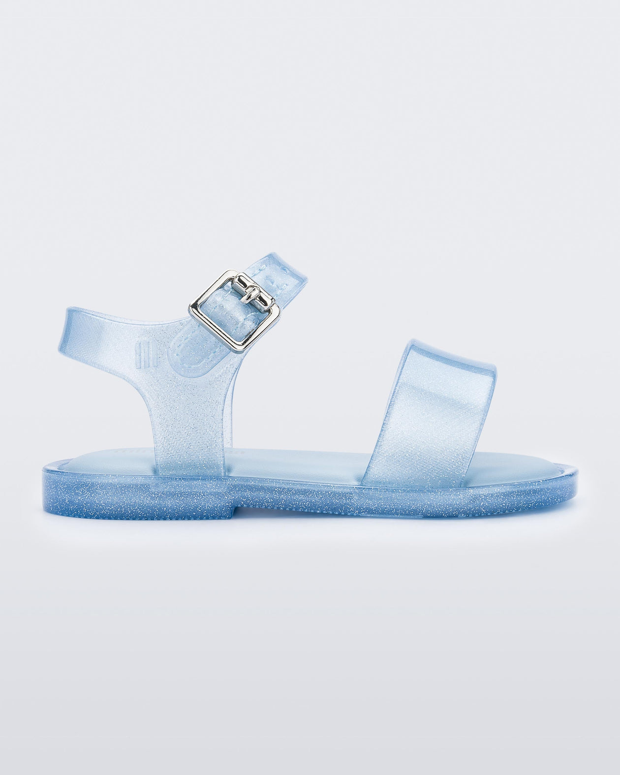 Side view of blue glitter Mini Melissa sandal with two straps and a metal buckle.