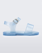 Side view of blue glitter Mini Melissa sandal with two straps and a metal buckle.