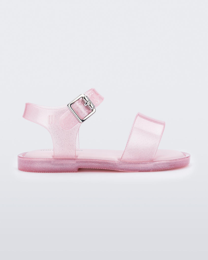 Side view of a pink glitter Mini Melissa Mar Sandal with two straps.