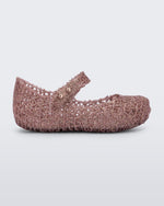 Side view of Mini Melissa Campana rose glitter flats with a snap strap for baby with an open woven texture