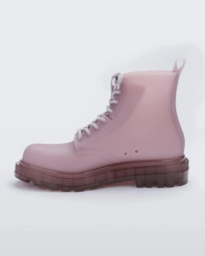 An inner side view of a pair of matte Beige/ pastel Lilac Melissa Coturno boot with a lilac base, beige laces and lilac sole.