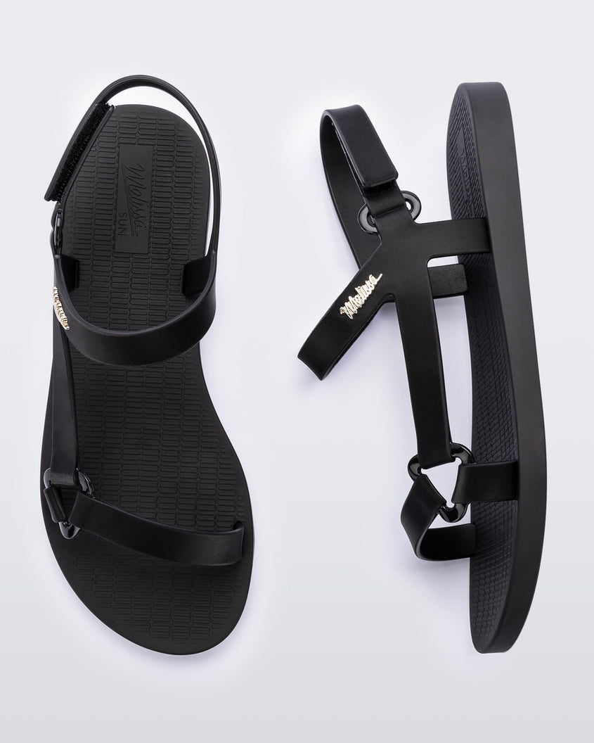 top and side view of a pair of the Melissa Sun Downtown sandals in black.