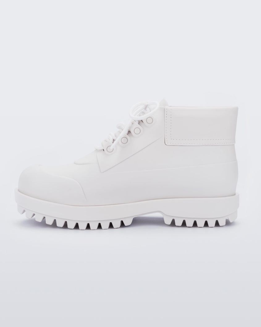 An inner side view of a matte white Melissa Ares combat boot with a matte white base, laces, top back and sole.