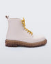 Side view of a matte beige/yellow Melissa Coturno boots with a matte beige base, yellow laces and a brown sole. 
