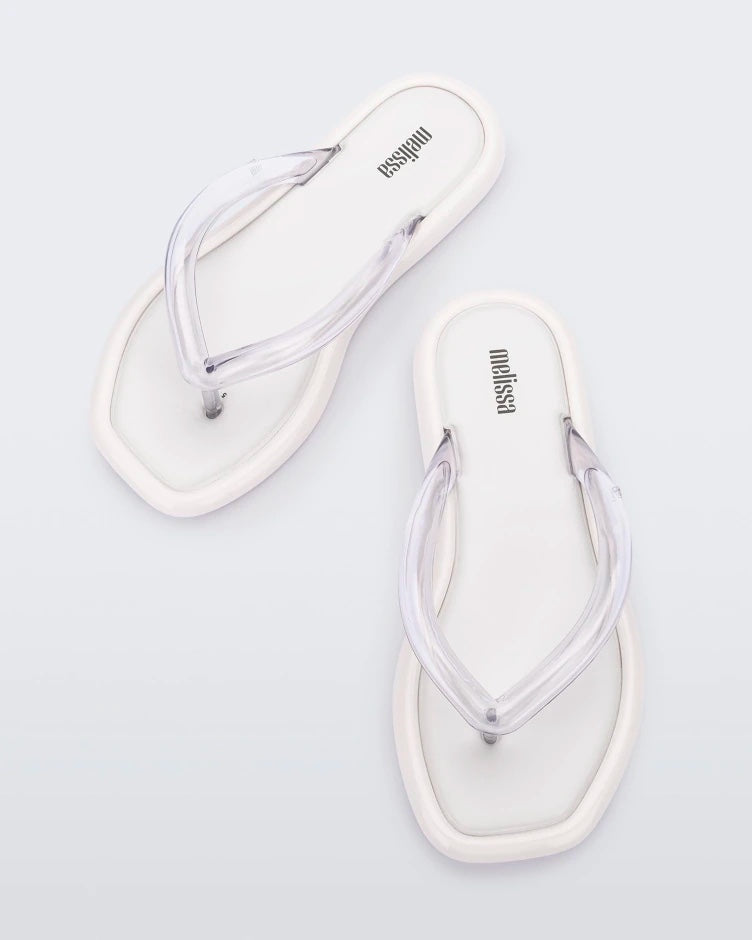 Top view of a pair of white Melissa Airbubble Flip Flops.